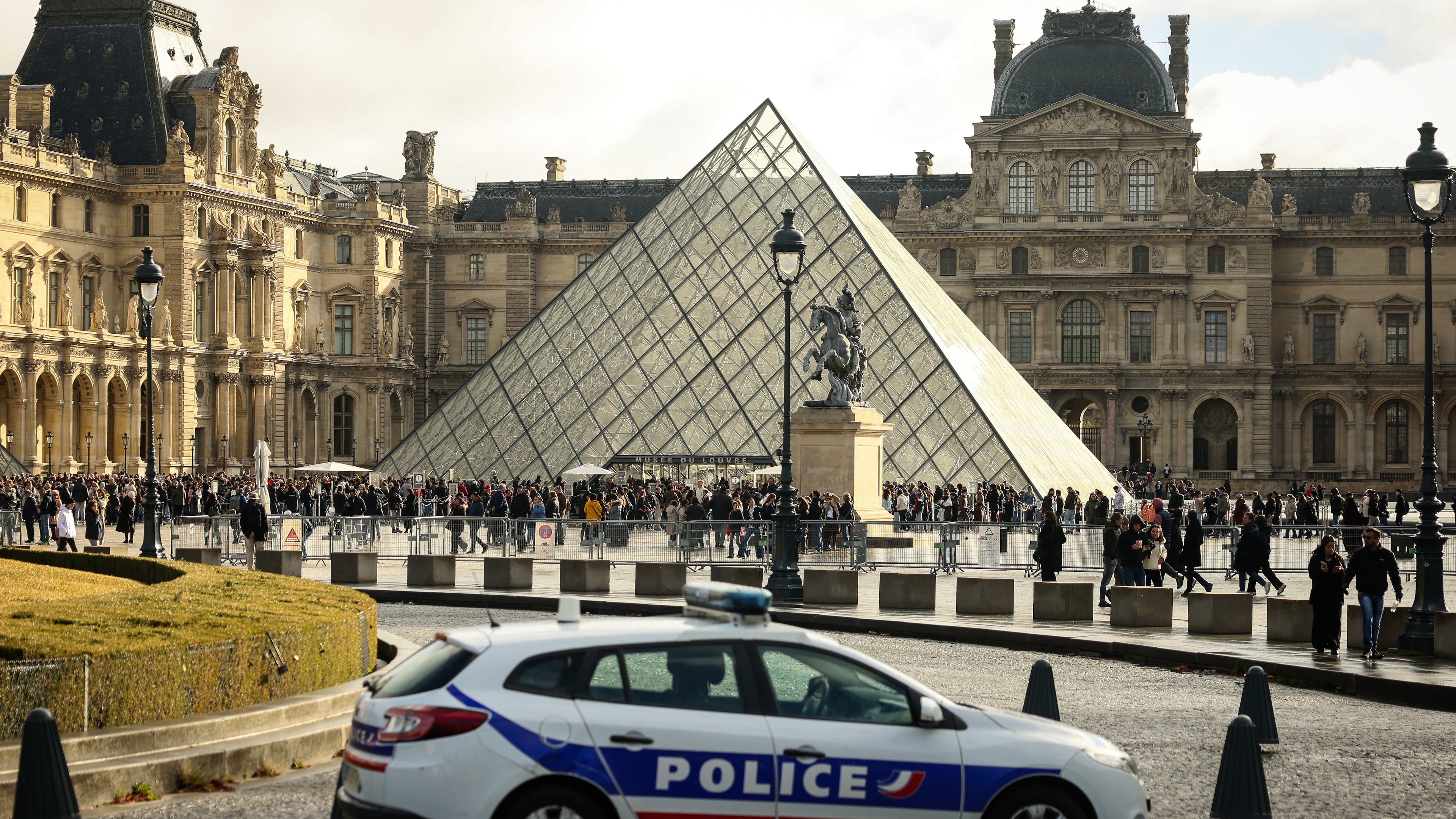 FILE - A police car parks in the courtyard of the Louvre museum, one week after the robbery, on Oct. 26, 2025, in Paris. (AP Photo/Thomas Padilla, File)