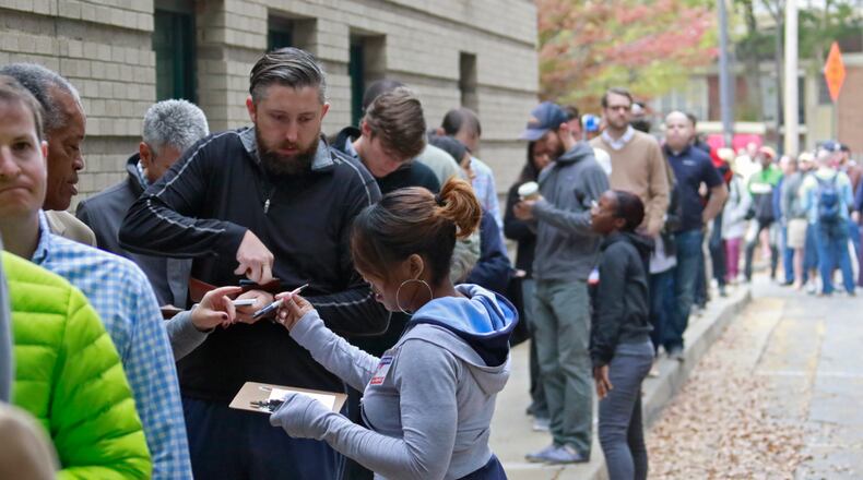 November 8, 2016 - Atlanta - The wait to vote at the Ponce Library was more than an hour this morning. Voters line up to cast their votes on the presidential election day in Atlanta on Tuesday, November 8 2016. BOB ANDRES /BANDRES@AJC.COM