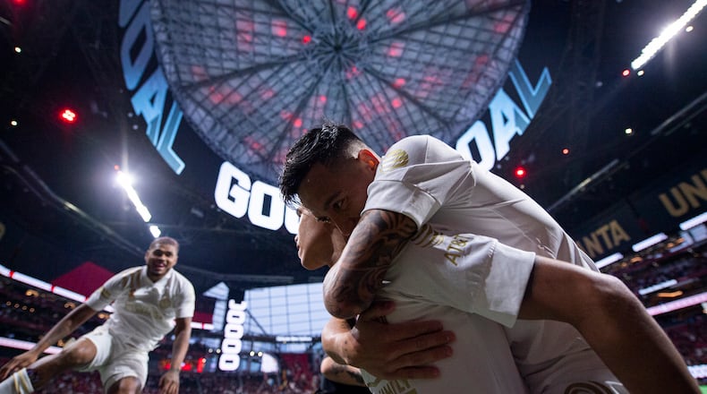 Atlanta United forward Luiz Araujo (19) celebrates with teammates after scoring his first goal Wednesday, Sept. 15, 2021, against Cincinnati at Mercedes-Benz Stadium in Atlanta. (Dakota Williams/Atlanta United)