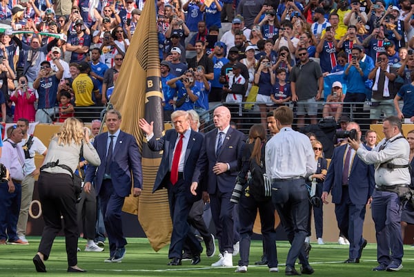 President Donald Trump (waving) participated in the trophy ceremony after the Club World Cup final soccer match at MetLife Stadium in East Rutherford, N.J., on Sunday.