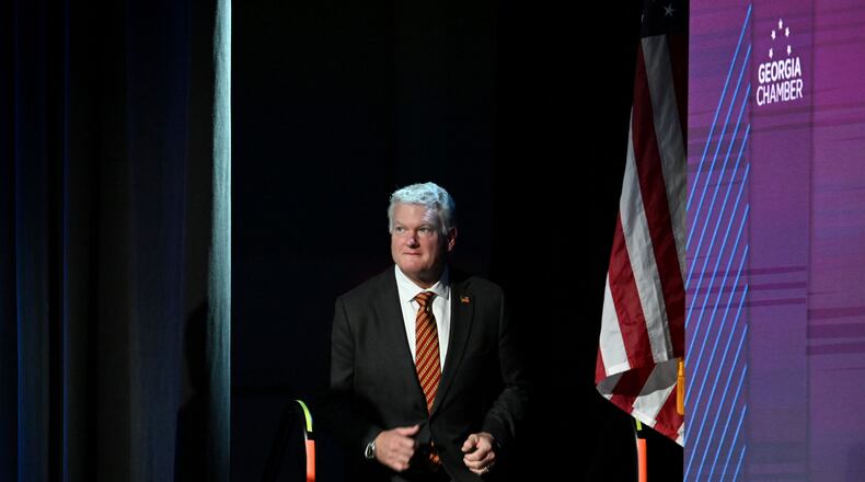 U.S. Rep. Mike Collins takes the stage before delivering a speech during the Georgia Chamber Congressional Luncheon at The Classic Center in Athens on Wednesday, Aug. 5, 2026. (Hyosub Shin/AJC)