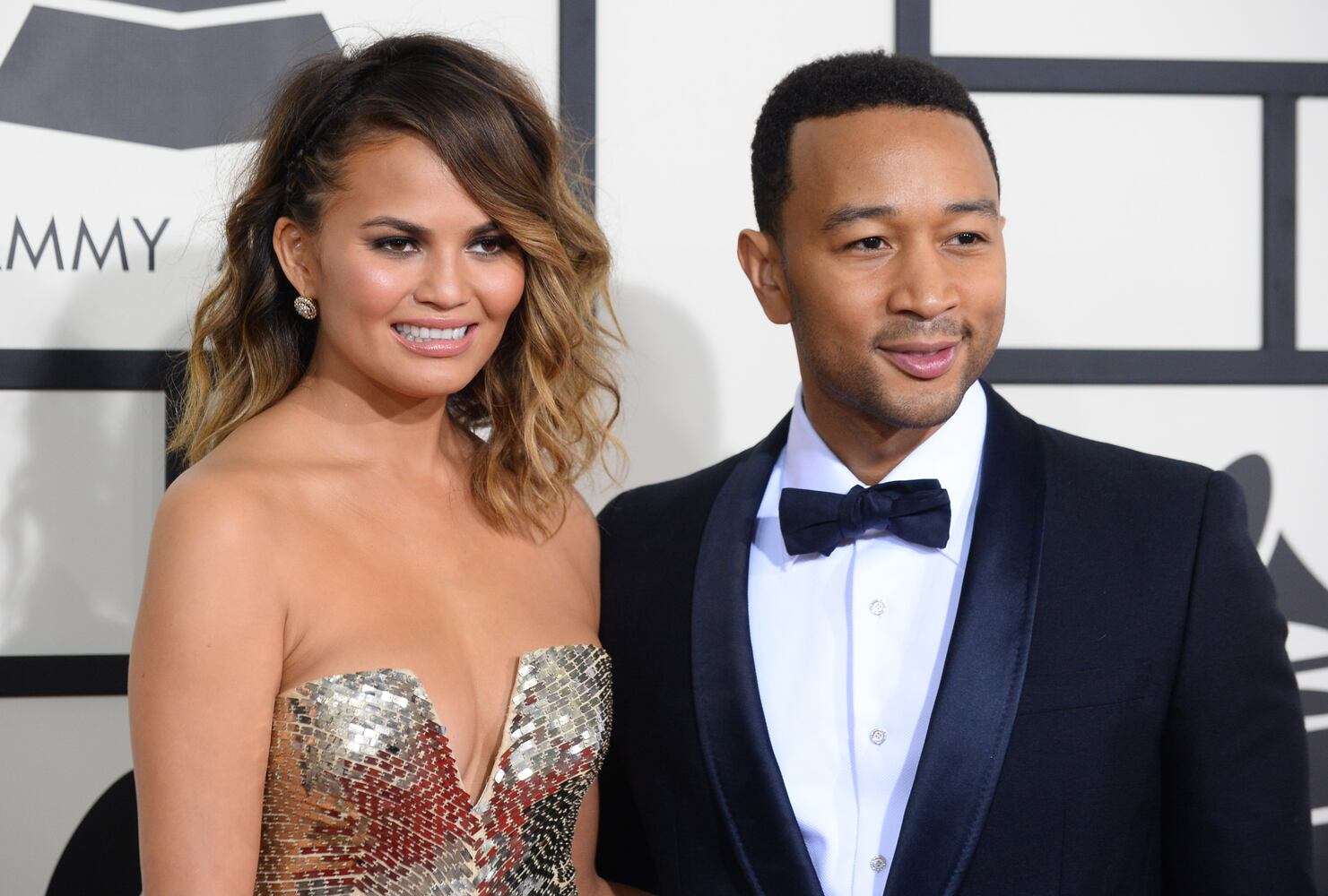 Metallics: Model Christine Teigen with husband John Legend