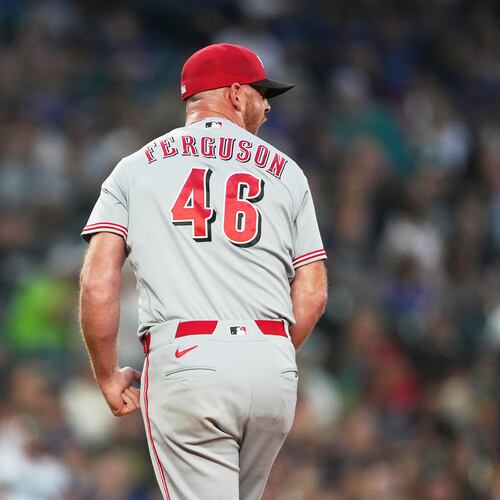 Cincinnati Reds relief pitcher Caleb Ferguson reacts in the seventh inning of a baseball game against the Seattle Mariners, Monday, July 20, 2026, in Seattle. (AP Photo/Lindsey Wasson)