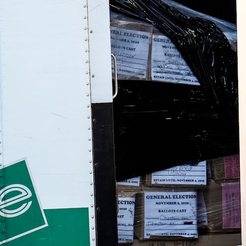 Georgia General Election 2020 ballots are loaded by the FBI onto trucks at the Fulton County Election HUB, Wednesday, Jan. 28, 2026, in Union City, Ga., near Atlanta. (AP Photo/Mike Stewart)