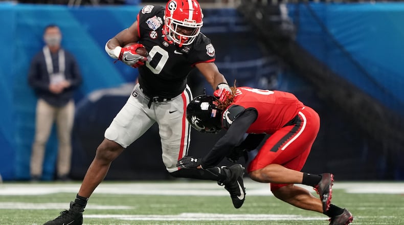 Georgia tight end Darnell Washington (0) turns up field to run after catching a pass against Cincinnati during the 2020 Chick-fil-A Peach Bowl on Jan. 1, 2021, at Mercedes-Benz Stadium in Atlanta. (Jason Parkhurst/UGA Athletics)