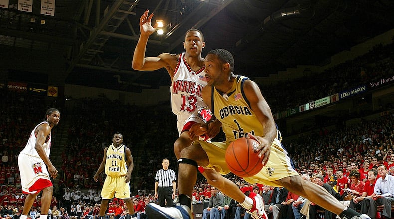 COLLEGE PARK, MD - FEBRUARY 19:  B.J. Elder #1 of the Georgia Tech Yellow Jackets drives the baseline around Chris McCray #13 of the Maryland Terrapins during ACC basketball action on February, 2004 at the Comcast Center in College Park, Maryland.  (Photo by Doug Pensinger/Getty Images)