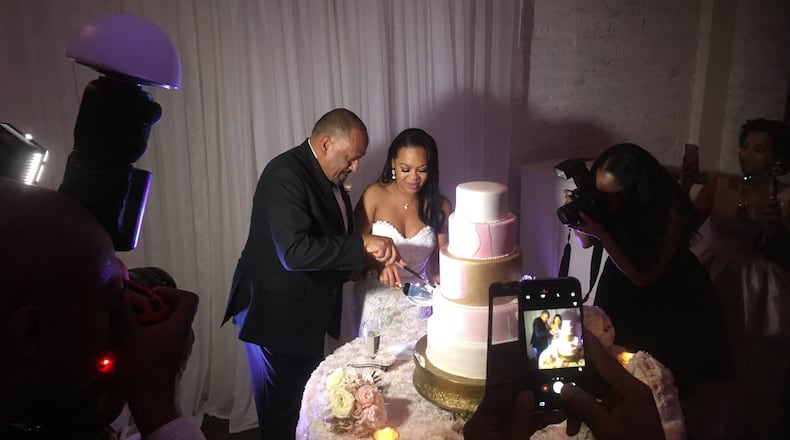 Frank Ski and Dr. Patrice Basanta-Henry cut their wedding cake at The Estate. Photos and videos: Jennifer Brett