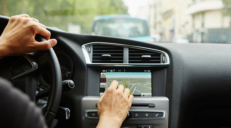 File photo of a woman using GPS in her car