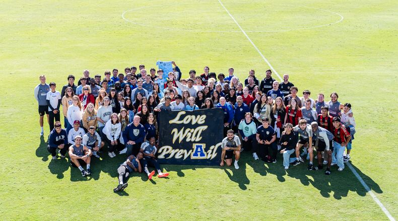 Atlanta United players pose with Apalachee High School students after a training session at Children’s Healthcare of Atlanta Training Ground in Marietta on Oct. 16, 2024. (Photo by Mitch Martin/Atlanta United)