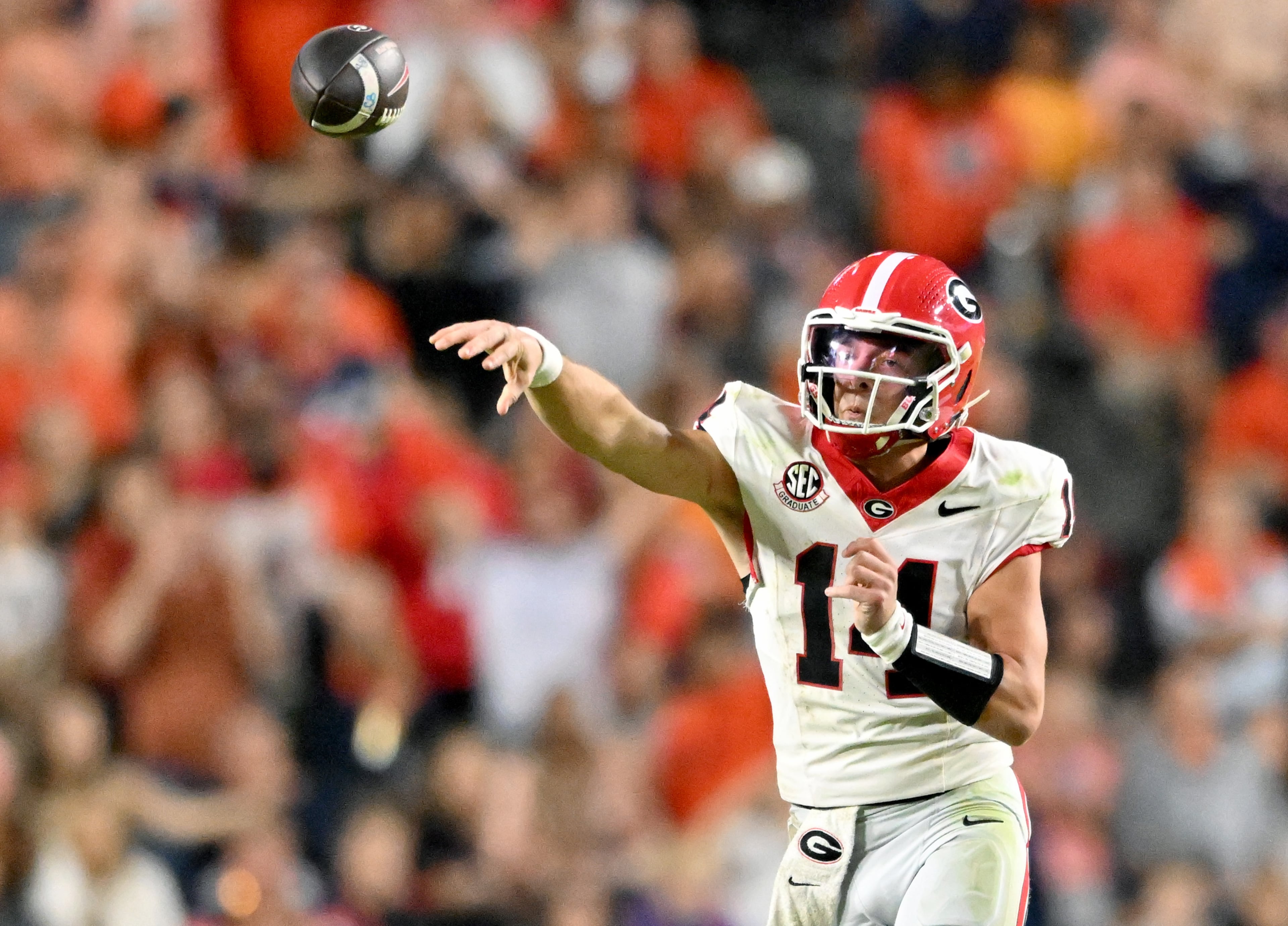 Georgia quarterback Gunner Stockton (14) gets off a pass during the second half in a NCAA college football game at Jordan-Hare Stadium, Saturday, October 11, 2025, in Auburn, Ala. Georgia won 20-10 overAuburn. (Hyosub Shin / AJC)