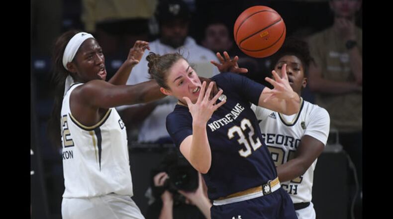 Notre Dame forward Jessica Shepard (32) vies for the ball with Georgia Tech forward Elizabeth Dixon, left, and guard Chanin Scott during an NCAA college basketball game, Sunday, Jan. 6, 2019, in Atlanta. (AP Photo/John Amis)