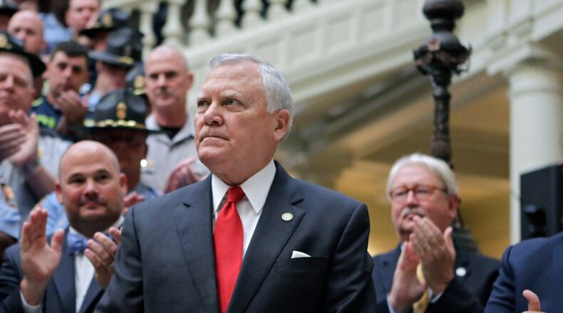 Gov. Nathan Deal, who earlier this month announced a $79 million plan to give 20 percent pay raises to more than 3,300 state law enforcement officers, has unveiled a plan to increase the pay for about 300 additional officers by 10 percent. BOB ANDRES /BANDRES@AJC.COM