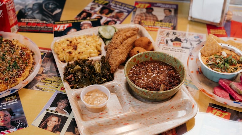 This catfish platter at Good Hot Fish includes Sea Island red peas, stewed greens, macaroni and cheese, refrigerator pickles, hush puppies and tartar sauce. Courtesy of Good Hot Fish