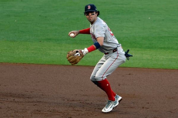Boston Red Sox shortstop Marcelo Mayer throws to first for the out on Atlanta Braves' Austin Riley during the third inning of a baseball game, Friday, May 30, 2025, in Atlanta. (AP Photo/Butch Dill)
