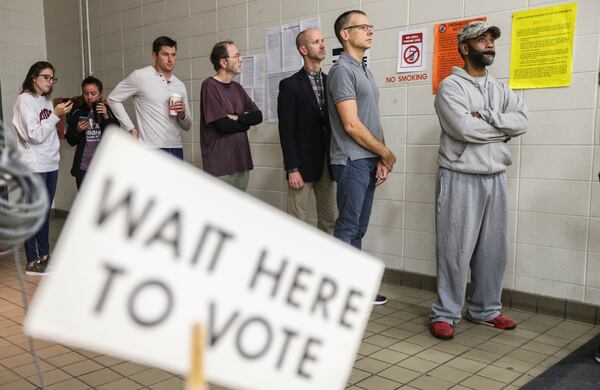 November 7, 2017 Atlanta: Voters lined up early at Henry W. Grady High School at 929 Charles Allen Dr NE in Atlanta on Tuesday, Nov. 7, 2017 to cast their votes. Only about 20,000 of 250,000 registered voters cast early ballots in Atlantas mayoral election, a likely sign of low turnout for Tuesdays vote to succeed Atlanta Mayor Kasim Reed. A late WSB-TV poll, released on Friday, showed Councilwoman Keisha Lance Bottoms leading Councilwoman Mary Norwood for the first time with 25 percent of the vote to Norwoods 23 percent.  JOHN SPINK/JSPINK@AJC.COM