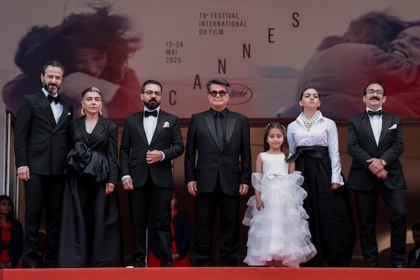 Ebrahim Azizi, from left, Mariam Afshari, Majid Panahi, director Jafar Panahi, Delnaz Najafi, Hadis Pakbaten, and Vahid Mobseri pose for photographers upon arrival at the premiere of the film 'It was just an accident' at the 78th international film festival, Cannes, southern France, Tuesday, May 20, 2025. (Photo by Lewis Joly/Invision/AP)