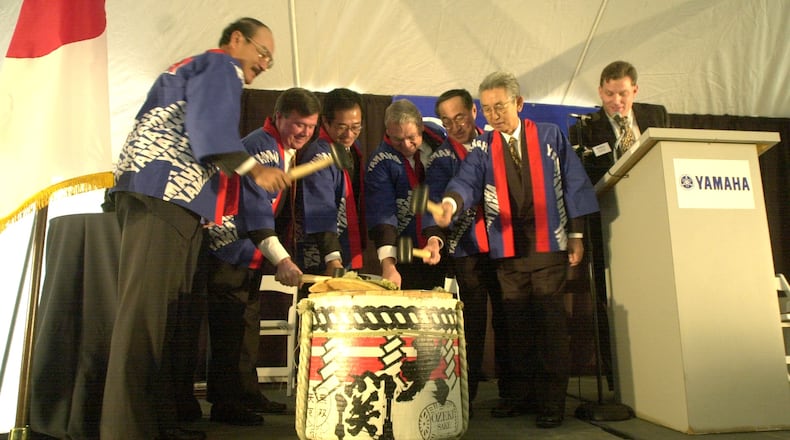 In this AJC file photo from 2000, Japanese executives and their American counterparts busted a keg of saki at groundbreaking ceremonies for the plant expansion at Yamaha Motor Manufacturing in Newnan. STAFF PHOTO BY W.A. BRIDGES JR.