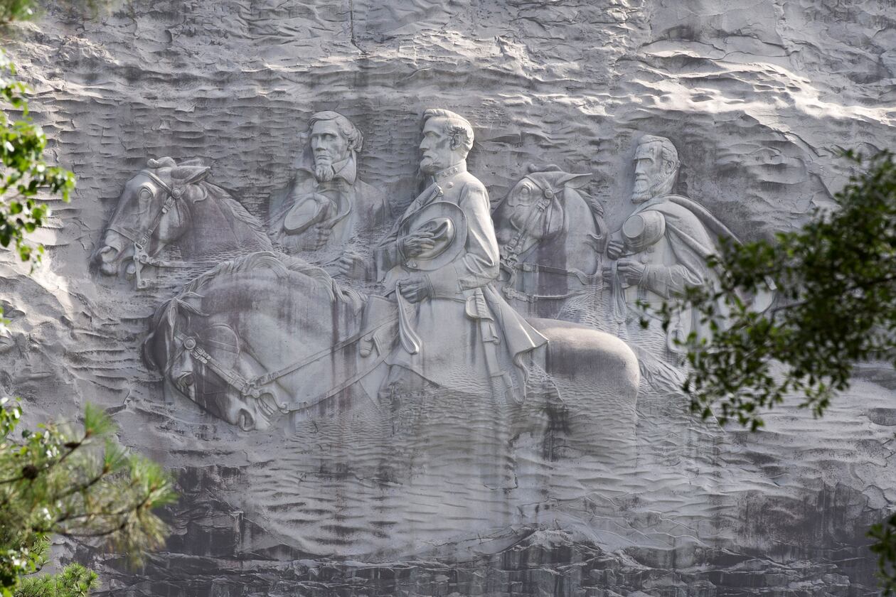 This June 23, 2015, file photo shows a carving depicting confederates Stonewall Jackson, Robert E. Lee and Jefferson Davis, in Stone Mountain, Georgia. (AP Photo/John Bazemore, File)