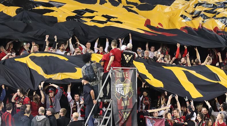 Fans unfurl the Atlanta United RC tifo to open the action against the New York Red Bulls Sunday.