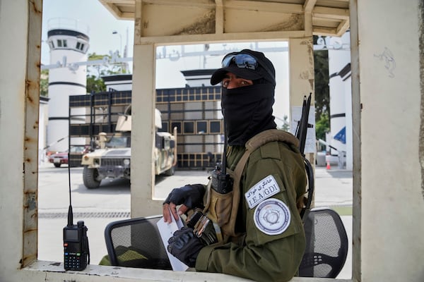 A Taliban fighter stands guard in front of the former US embassy in Kabul, Afghanistan, Thursday, June 5, 2025. (AP Photo/Ebrahim Noroozi)