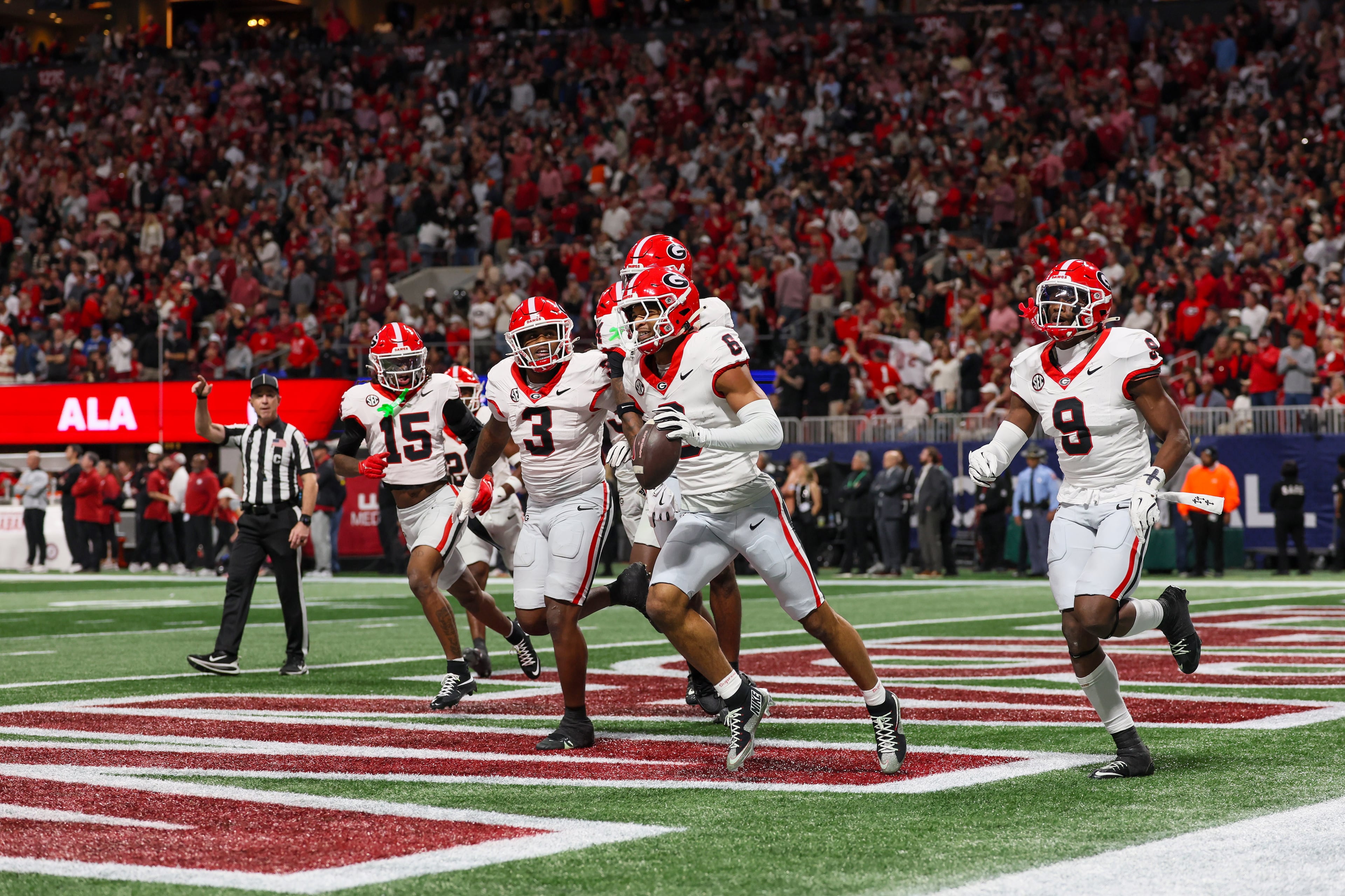 Georgia defensive back Daylen Everette (6) celebrates with teammates after an interception against Alabama during the first quarter of the SEC Championship game at Mercedes-Benz Stadium, Saturday, Dec. 6, 2025, in Atlanta. (Jason Getz / AJC)