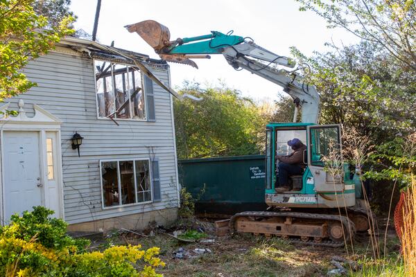 DeKalb County officials demolish a home as part of their efforts to address blight in Stone Mountain Friday, April 1, 2022. STEVE SCHAEFER FOR THE ATLANTA JOURNAL-CONSTITUTION
