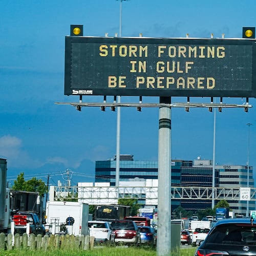 Motorists drive by Texas Department of Transportation signs on I-610 as Tropical Storm Edouard approaches in Houston, Tuesday, Sept. 1, 2026. (Elizabeth Conley/Houston Chronicle via AP)