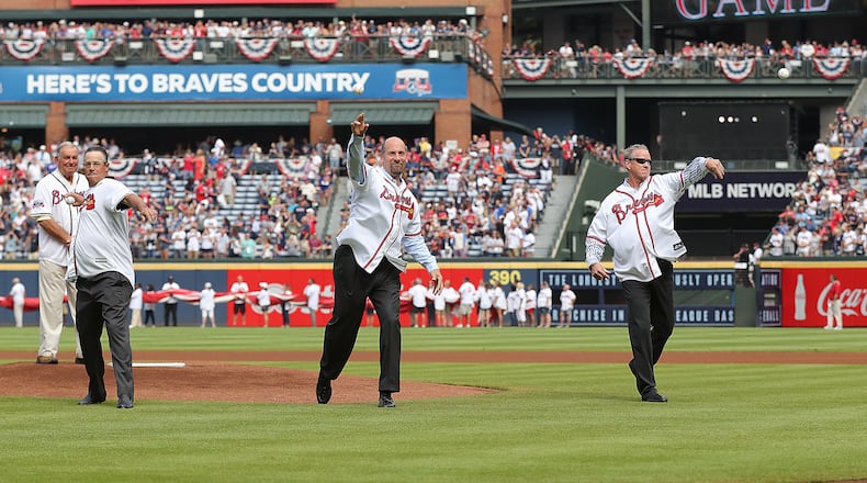 Hall of Fame manager Bobby Cox (from left) looks on as Hall of Fame pitchers Greg Maddux, John Smoltz, and Tom Glavine throw out the first pitch for the Braves final game at Turner Field on Sunday, Oct. 2, 2016, in Atlanta. Curtis Compton /ccompton@ajc.com