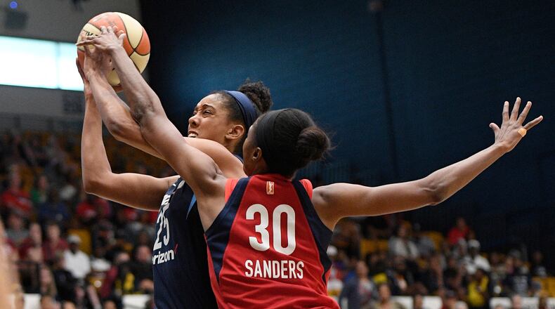 Atlanta Dream forward Monique Billings (25) is fouled by Washington Mystics forward LaToya Sanders (30) during the first half of Game 4 of a WNBA basketball playoffs semifinal Sunday, Sept. 2, 2018, in Washington.