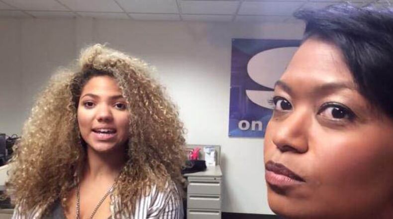 Angela Green (right), a biracial television anchor for WNCT in Greenville, N.C., posted a video on her station's Facebook page asking whether intern Madison Jaggars (left) should straighten her hair for the sake of her career. (Courtesy of Angela Green)