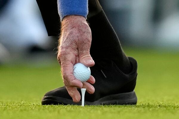 Honorary Starter Jack Nicklaus places his ball on the tee on the first hole during the first round at the Masters golf tournament, Thursday, April 10, 2025, in Augusta, Ga. (AP Photo/David J. Phillip)