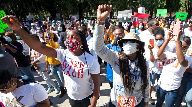 People react during a rally to protest the shooting of Ahmaud Arbery, a young black man who was shot to death on Feb. 23 in Brunswick, Georgia, after being pursued by a white father and son who said he fit the profile of a burglary suspect. (John Bazemore/Associated Press)