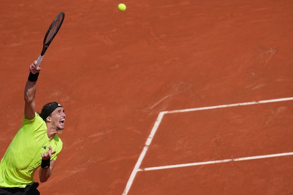 Germany's Alexander Zverev serves against Italy's Flavio Cobolli during their third round match of the French Tennis Open, at the Roland-Garros stadium, in Paris, Saturday, May 31, 2025. (AP Photo/Christophe Ena)