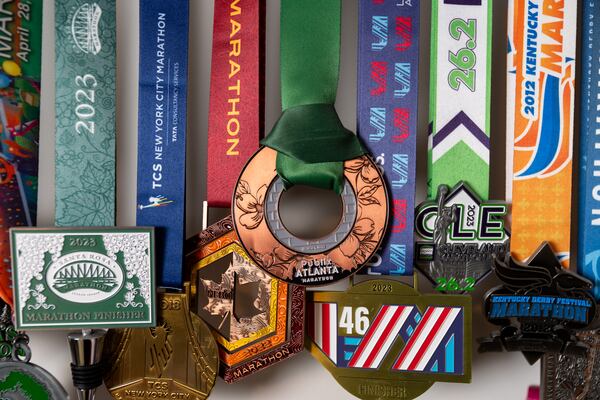 Caroline Burnet’s running medals are seen at her home in Atlanta on Friday, February 28, 2025. Burnet will be running her 200th marathon. (Arvin Temkar / AJC)