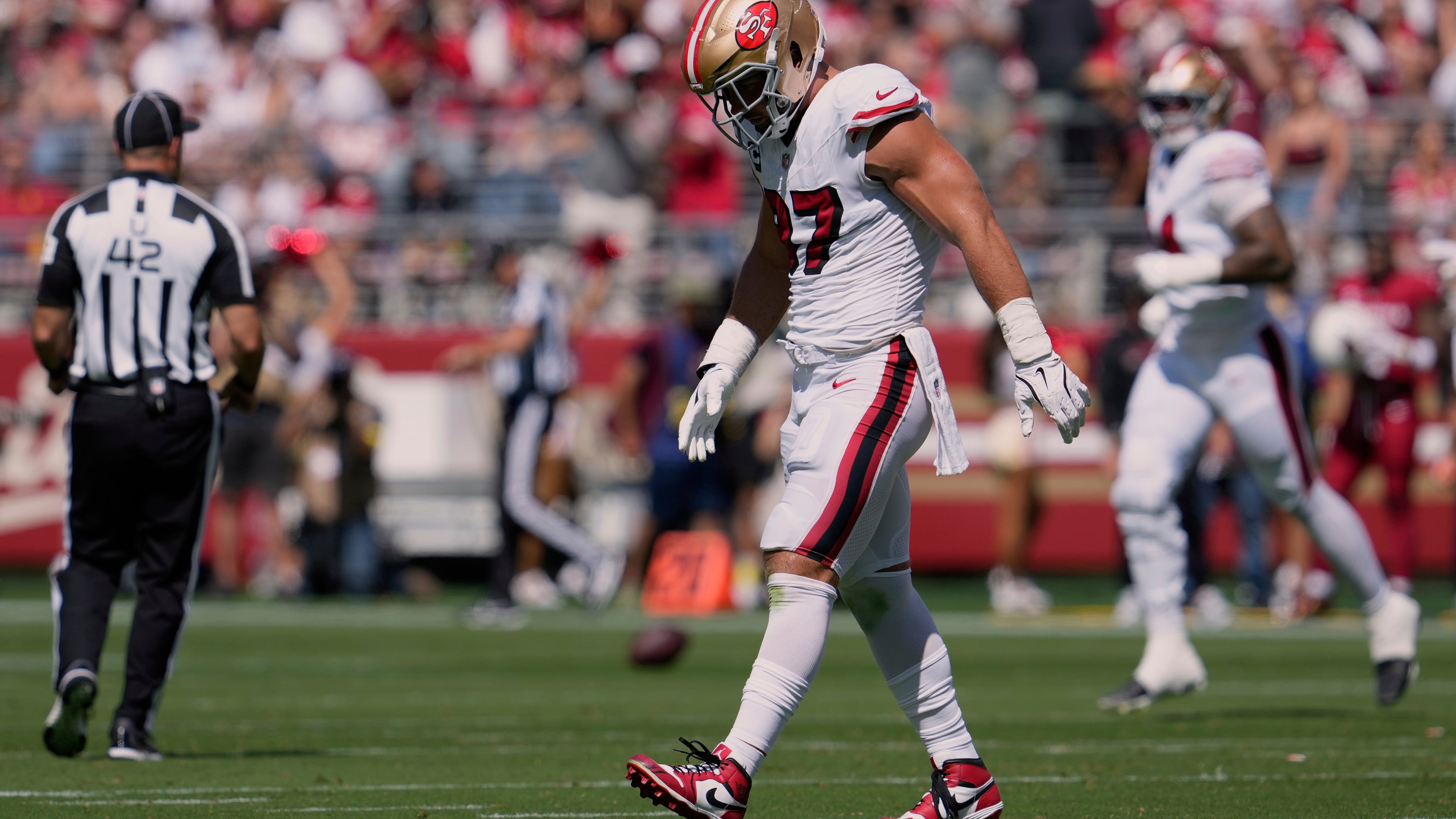 San Francisco 49ers defensive end Nick Bosa walks off the field during the first half of an NFL football game against the Arizona Cardinals, Sunday, Sept. 21, 2025, in Santa Clara, Calif. (AP Photo/Godofredo A. Vásquez)