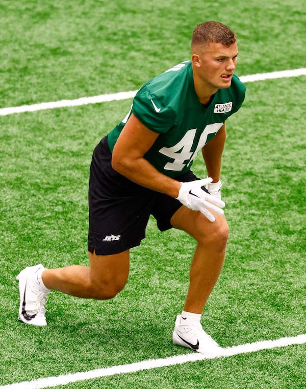 New York Jets tight end Mason Taylor (46) stretches during the NFL football team's rookie camp, Friday, May 9, 2025, in Florham Park, N.J. (AP Photo/Noah K. Murray)