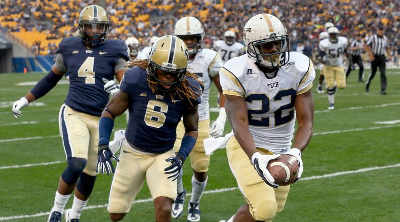 Georgia Tech running back Broderick Snoddy (22) outruns Pittsburgh linebacker Todd Thomas (8) for a touchdown in the first quarter of an NCAA football game, Saturday, Oct. 25, 2014, in Pittsburgh. (AP Photo/Keith Srakocic) Tech's Broderick Snoddy runs for one of his three touchdowns against Pitt. (AP photo)