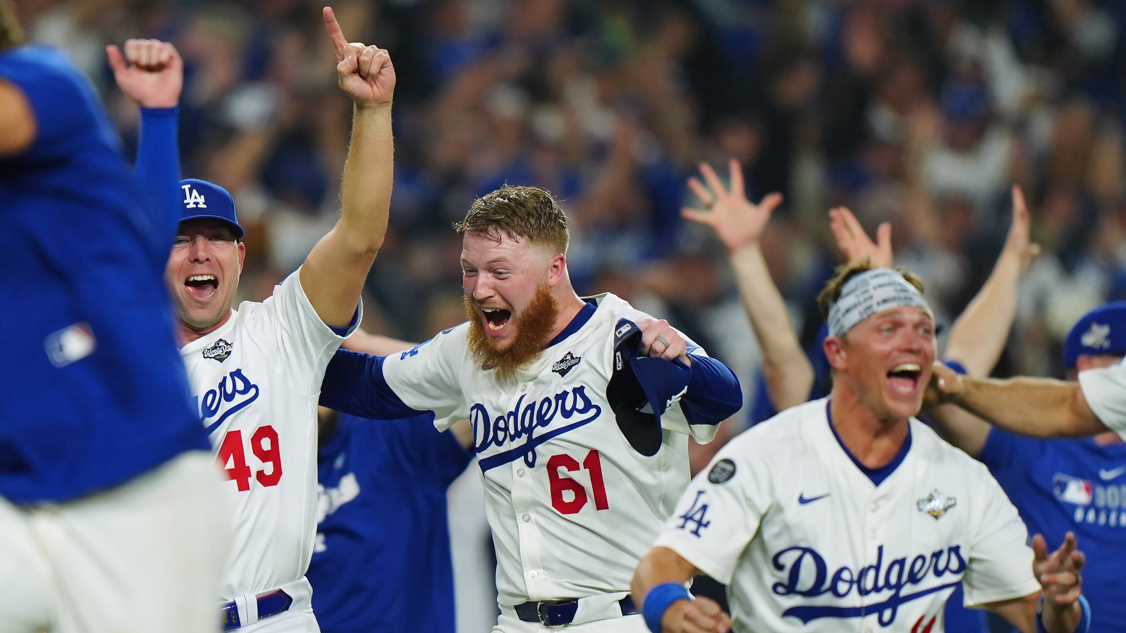 Winning Los Angeles Dodgers pitcher Will Klein (61) celebrates with Blake Treinen (49) and Alex Call (12) during 18th inning Game 3 World Series playoff MLB baseball action in Los Angeles on Monday, Oct. 27, 2025. (Frank Gunn/The Canadian Press via AP)