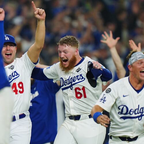 Winning Los Angeles Dodgers pitcher Will Klein (61) celebrates with Blake Treinen (49) and Alex Call (12) during 18th inning Game 3 World Series playoff MLB baseball action in Los Angeles on Monday, Oct. 27, 2025. (Frank Gunn/The Canadian Press via AP)