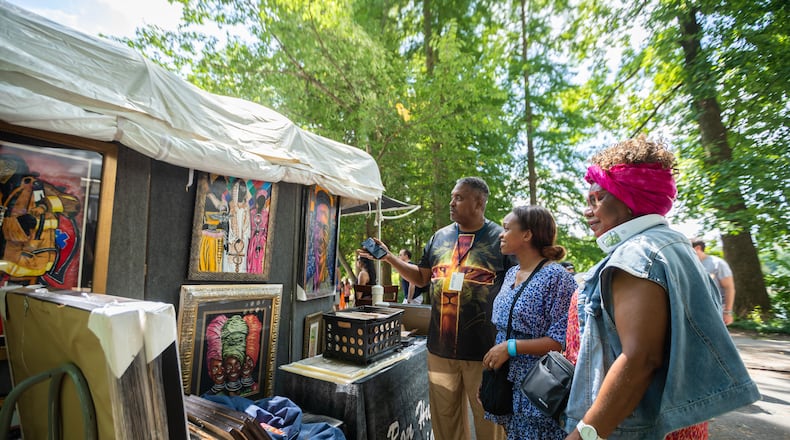 Attendees looking at artwork at the Piedmont Park Arts Festival