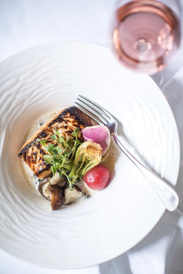 Sake Norwegian salmon is marinated in sake, with mirin and ginger and served with caramelized baby bok choy and shitake mushrooms. (Heidi Geldhauser)