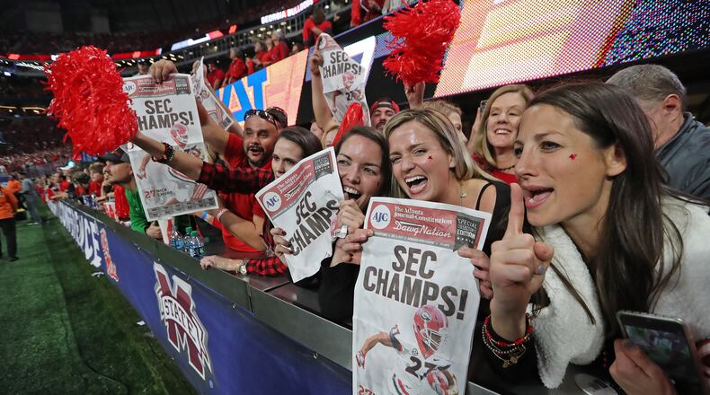 December 2, 2017 Atlanta: Georgia fans celebrate after the Bulldogs defeated Auburn 28-7 during the SEC Football Championship at Mercedes-Benz Stadium, December 2, 2017, in Atlanta. Curtis Compton / ccompton@ajc.com