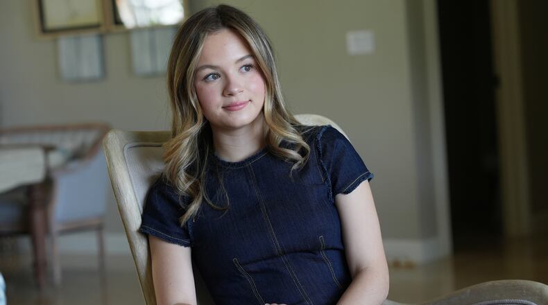 Lauryn Muller sits at her home Monday, April 13, 2026, in Coral Springs, Fla. (AP Photo/Marta Lavandier)