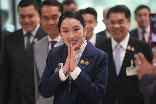 Thailand's Prime Minister Paetongtarn Shinawatra arrives at parliament before no-confidence vote against her in Bangkok, Thailand, Wednesday, March 26, 2025. (AP Photo/Sakchai Lalit)