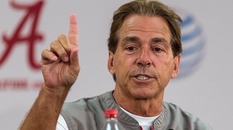 Alabama coach Nick Saban talks with reporters after NCAA college football practice Thursday, Aug 6, 2015, in Tuscaloosa, Ala. (Vasha Hunt/AL.com via AP)