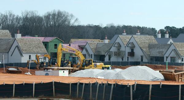 While many small towns in Georgia lost population, cities in the Atlanta metro area have swelled. Fayetteville now has 17,827 residents, according to new Census Bureau estimates. Population gains have spurred construction, such as this mixed-use development across the street from Pinewood Studios. EMILY HANEY / emily.haney@ajc.com