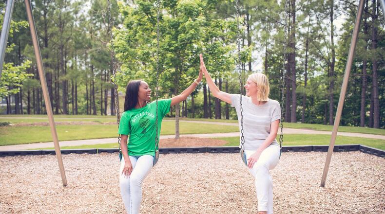 Jody Stephenson (right), founder of SitterTree, gives sitter Khadijah Grier a high-five. Grier was recently ranked a Top 10 Sitter. CONTRIBUTED BY ROSETREE PHOTOGRAPHY