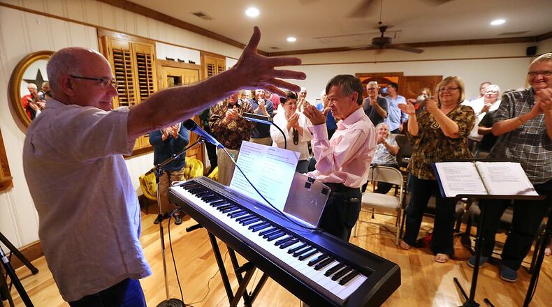 Bruce Gilbert responds to a standing ovation at the conclusion of his performance at Heron House in Mountain Park last month.
