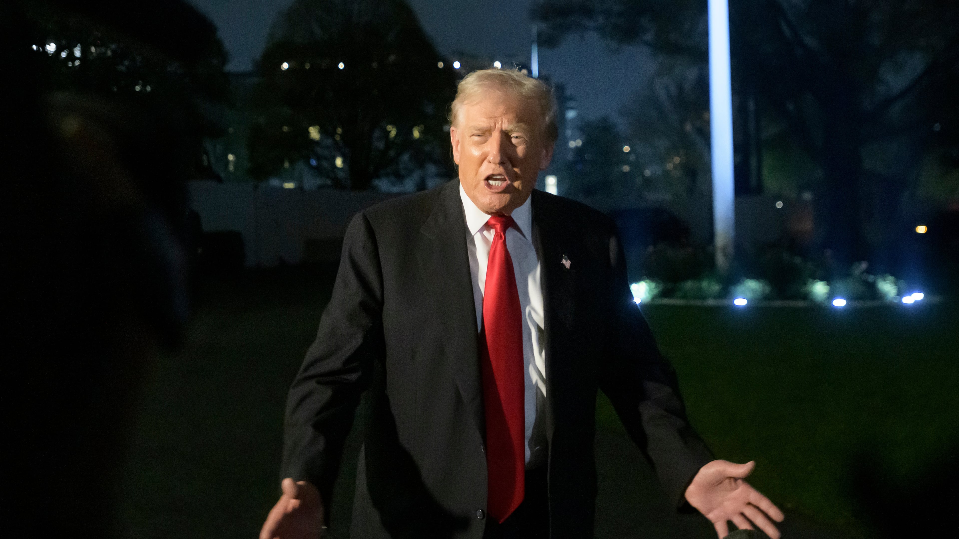 President Donald Trump talks with reporters upon his arrival at the White House in Washington, Sunday, Nov. 9, 2025. (AP Photo/Rod Lamkey, Jr.)