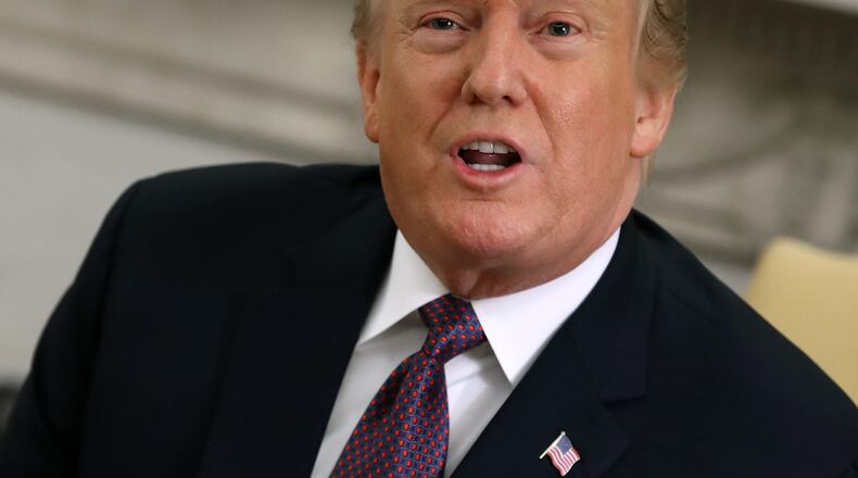 President Donald Trump speaks to the press during a meeting with Hungarian Prime Minister Viktor Orban in the Oval Office on Monday. Mark Wilson/Getty Images